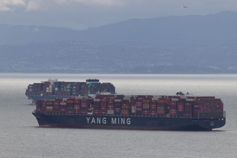 Traders analyzing market data on tariffs and inflation impacts - Global Banking & Finance Review