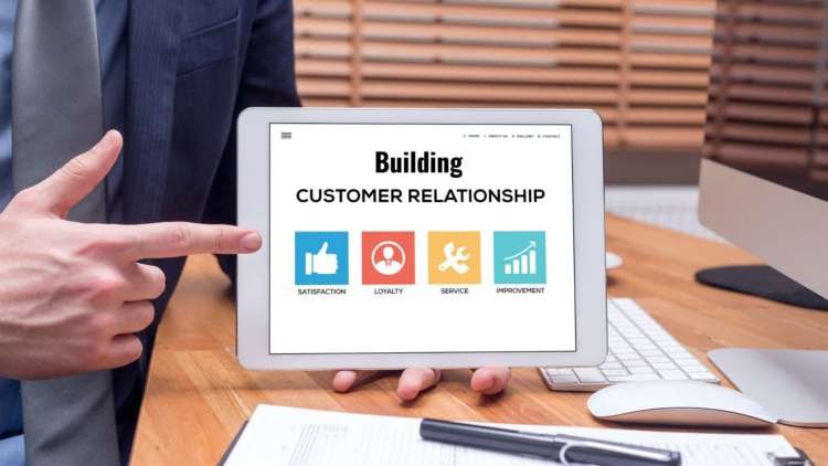 A diverse group of customers engaging with user generated content - Global Banking & Finance Review