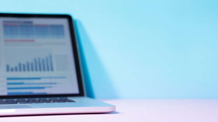 Financial graphs on a laptop screen depicting cash management strategies for CFOs - Global Banking & Finance Review