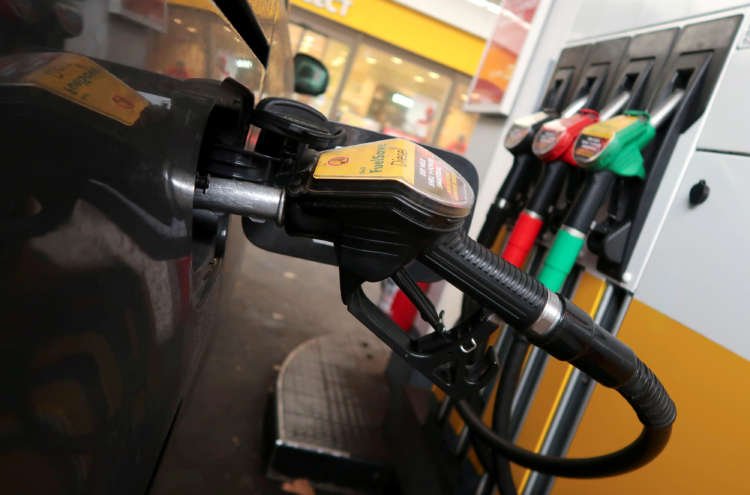 Shell petrol station in Berlin showcasing diesel fuel nozzle amid green transition efforts - Global Banking & Finance Review