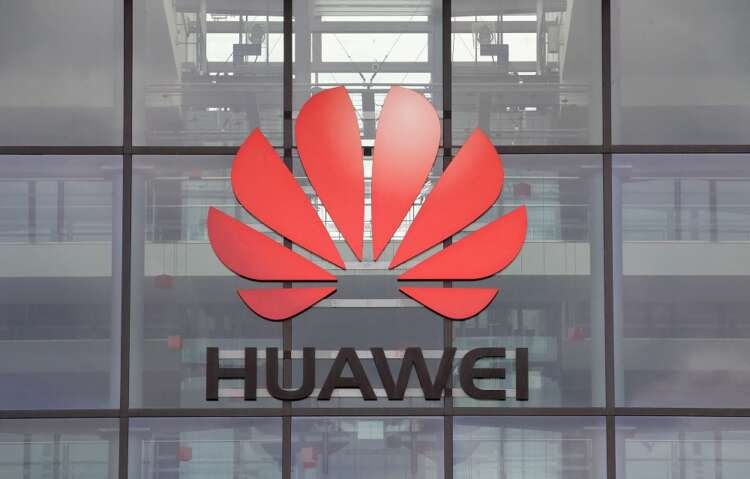 FILE PHOTO: Huawei logo is pictured on the headquarters building in Reading
