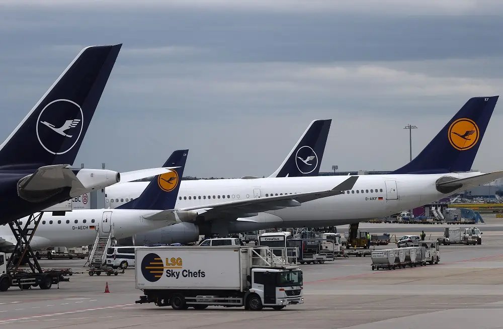 Lufthansa logo with financial graphs depicting a 9% profit drop - Global Banking & Finance Review
