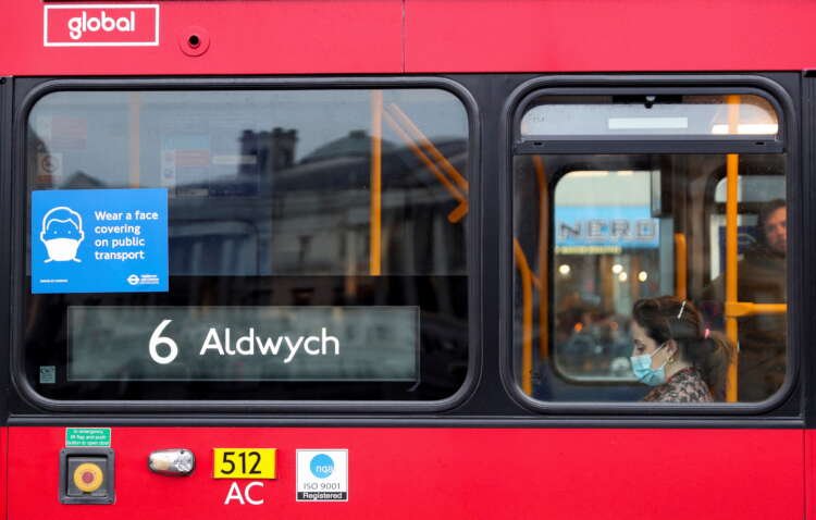 COVID-19 notice on a London bus amid Boris Johnson's plan to lift restrictions - Global Banking & Finance Review