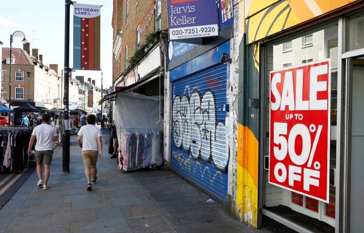 Men walk past empty retail units as UK retailers face worst October sales decline - Global Banking & Finance Review