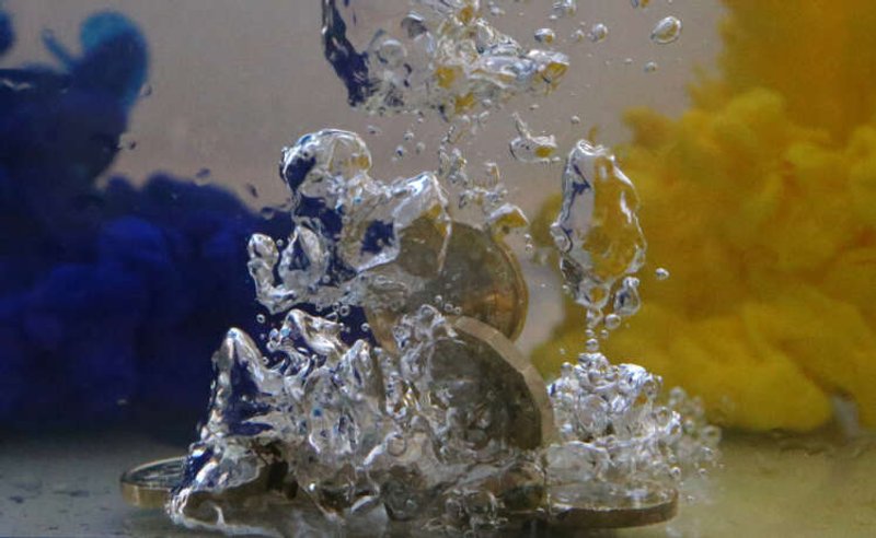 Image for Sterling drops after UK economy contracts by more than expected