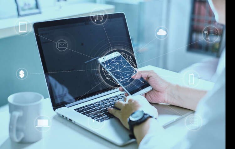 Man using a digital device for online payments, representing Open Banking - Global Banking & Finance Review