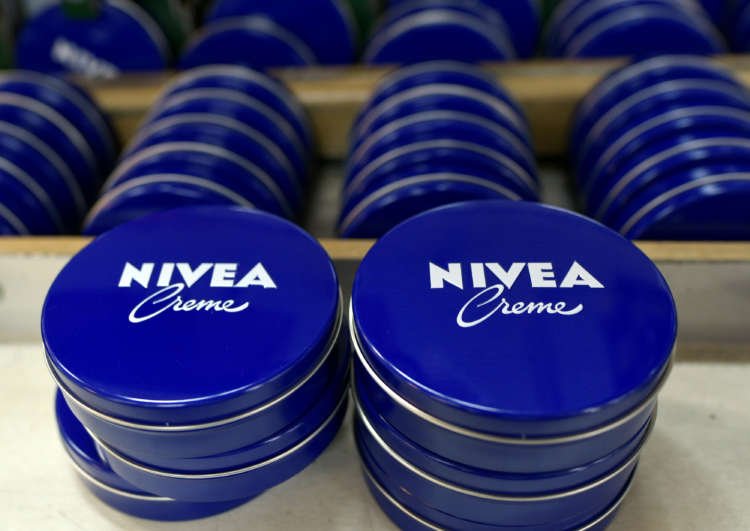 FILE PHOTO: Nivea tins are seen in a production line at the plant of German personal-care company Beiersdorf in Hamburg