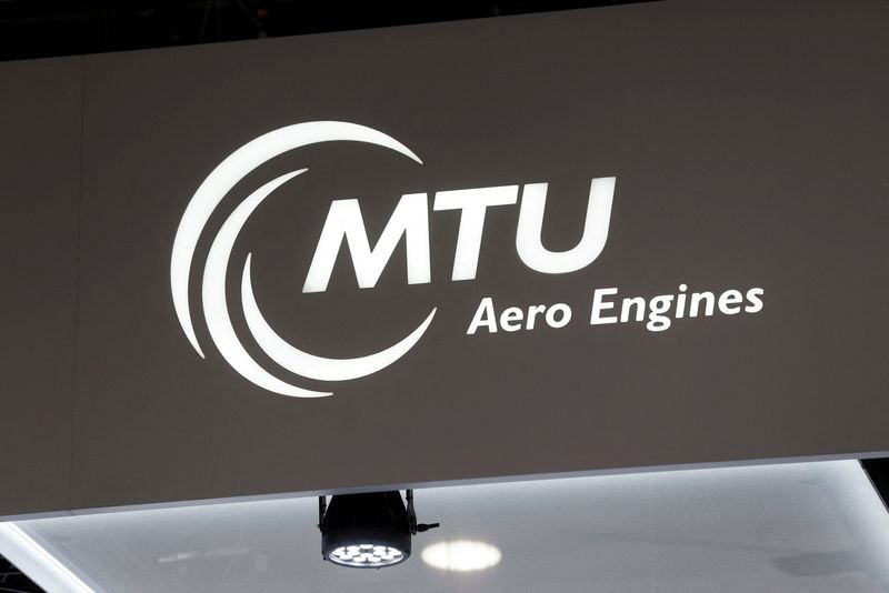 MTU Aero Engines logo with a backdrop of US dollar bills - Global Banking & Finance Review