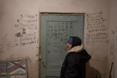 Image for Ukrainian villagers count dead after weeks confined in school basement