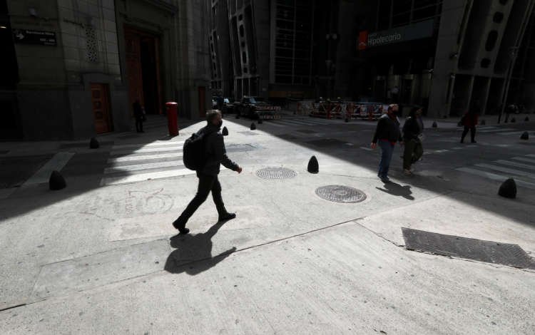 Pedestrians walk in Buenos Aires’ financial district
