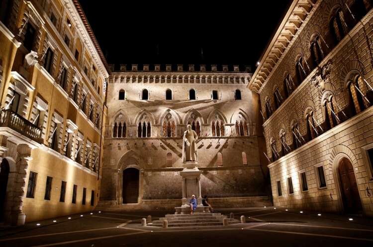 FILE PHOTO: The entrance of Monte dei Paschi di Siena bank’s headquarter is seen in downtown Siena