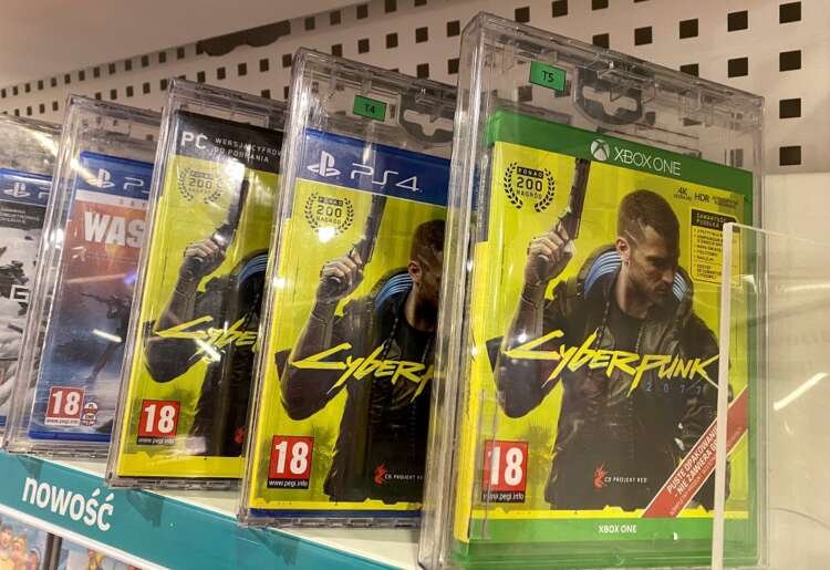 CD Projekt's Cyberpunk 2077 game boxes showcased in Warsaw, highlighting video game expansion - Global Banking & Finance Review