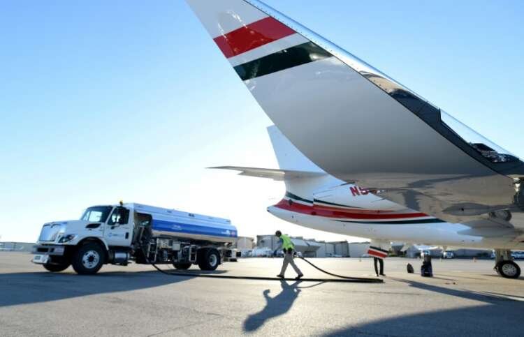 Airplane in flight representing sustainable aviation fuel initiatives - Global Banking & Finance Review