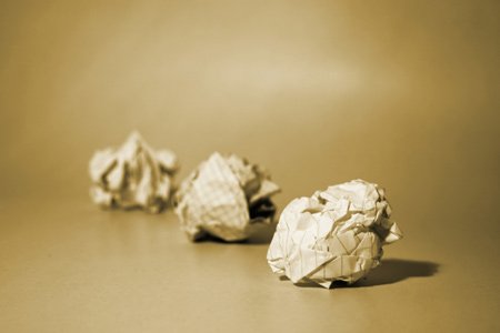 Image depicting a stack of paper documents symbolizing outdated financial processes - Global Banking & Finance Review