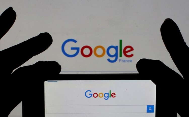 Woman using smartphone displaying Google homepage, highlighting mobile browser dominance - Global Banking & Finance Review