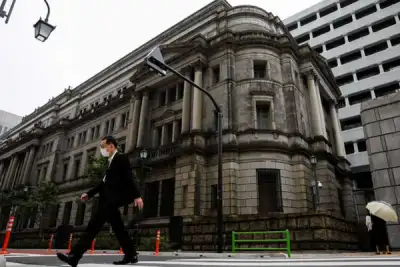 Image for BOJ signals prolonged easing, cuts price outlook as new COVID pain hits