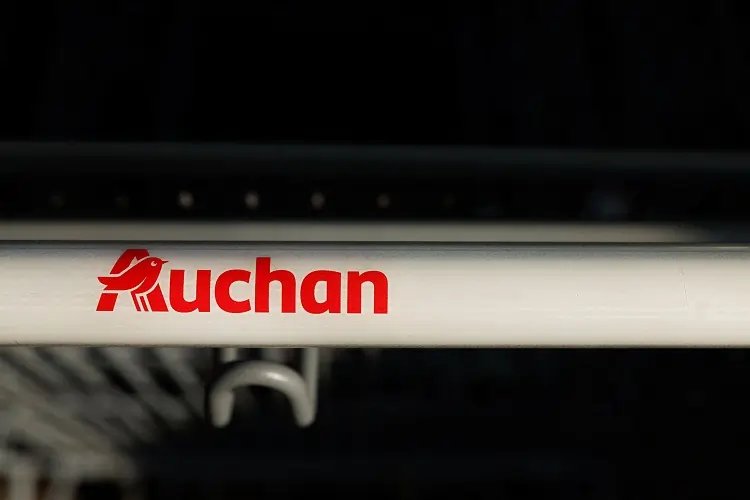 Auchan supermarket storefront reflecting job cuts news - Global Banking & Finance Review