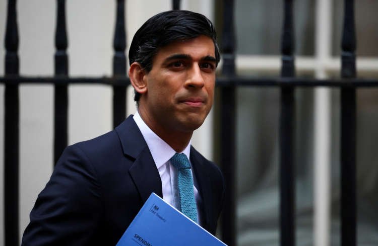 FILE PHOTO: Britain’s Chancellor of the Exchequer Sunak outside Downing Street, in London