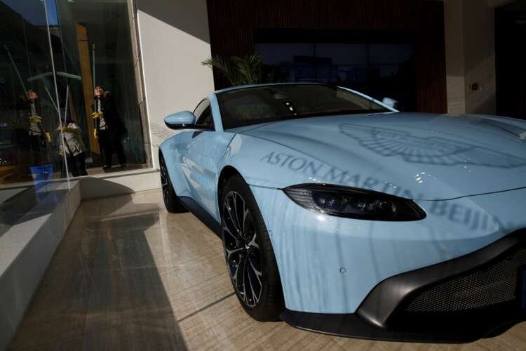 Aston Martin luxury sports car with logo, reflecting production challenges - Global Banking & Finance Review