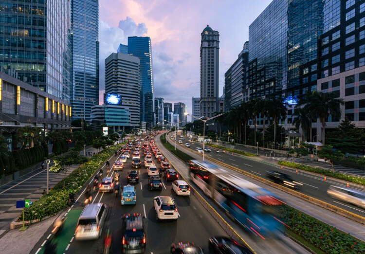 Traffic flows past skyscrapers in Indonesia's business district, highlighting the nation's economic growth - Global Banking & Finance Review