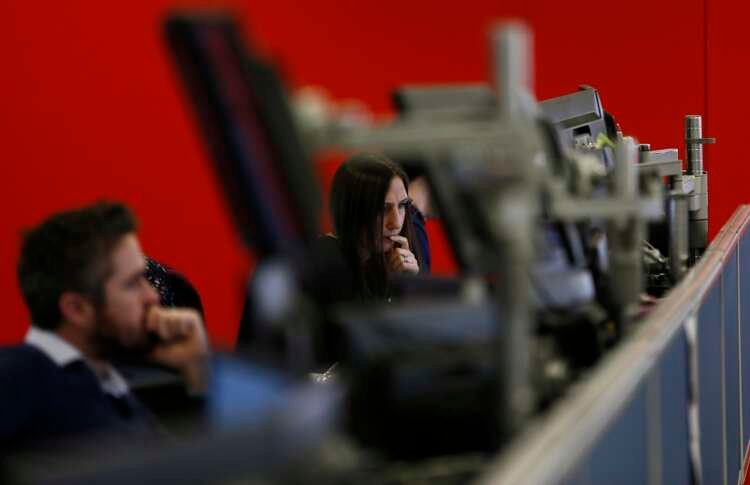 Traders analyzing market shifts in London amidst Russian ETF volatility - Global Banking & Finance Review