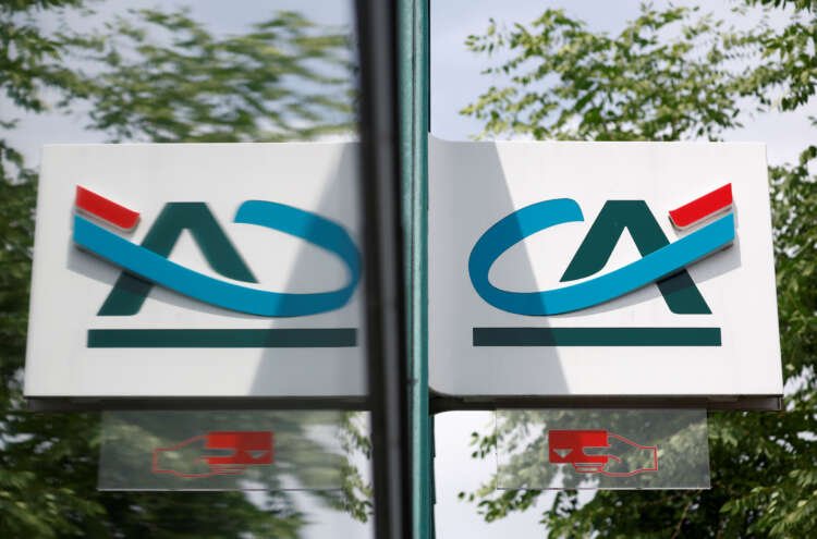 Credit Agricole's logo displayed outside a bank office, symbolizing its expansion into car-sharing services - Global Banking & Finance Review