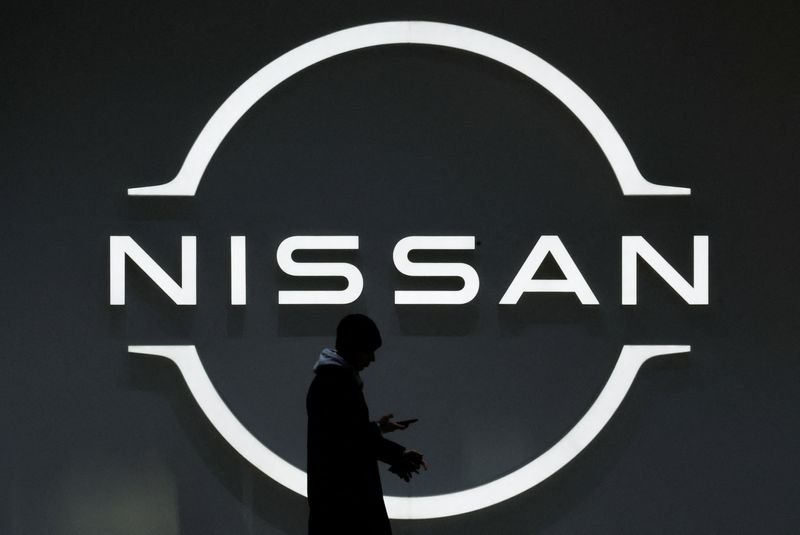 Nissan's logo with a declining profit graph, highlighting financial challenges - Global Banking & Finance Review
