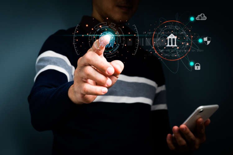 Business professionals utilizing biometric technology for secure banking access - Global Banking & Finance Review