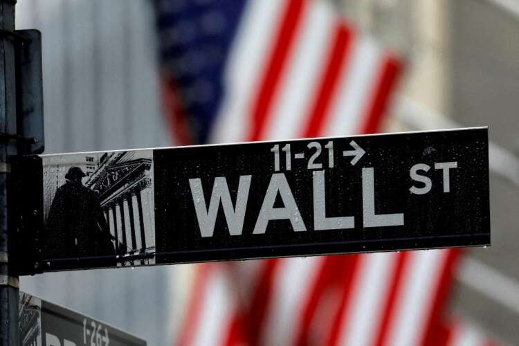 Wall Street sign with raindrops, symbolizing market rally amid UK policy changes - Global Banking & Finance Review