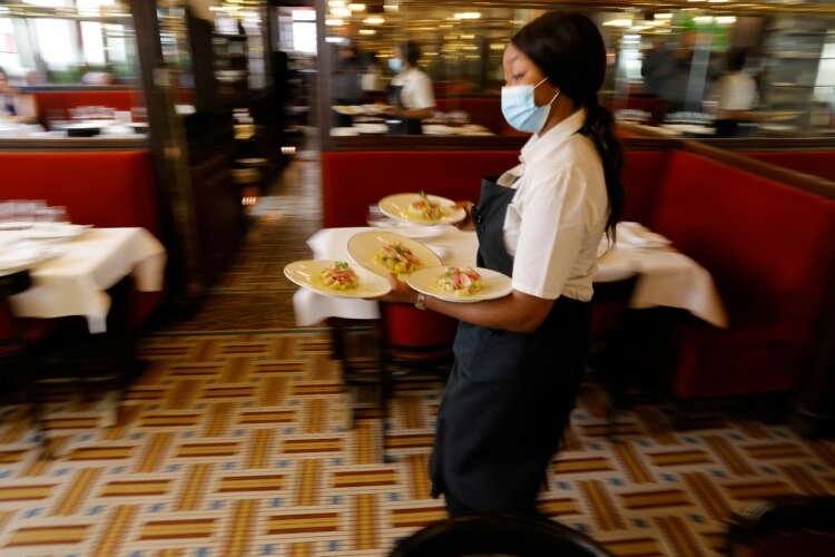 Restaurants reopen indoor dining rooms with an easing of COVID-19 restrictions in France