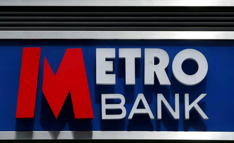 Metro Bank signage outside a branch in London, related to banking fines - Global Banking & Finance Review