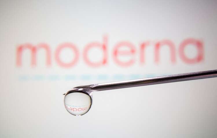 Moderna logo reflected in syringe needle, symbolizing vaccine development - Global Banking & Finance Review