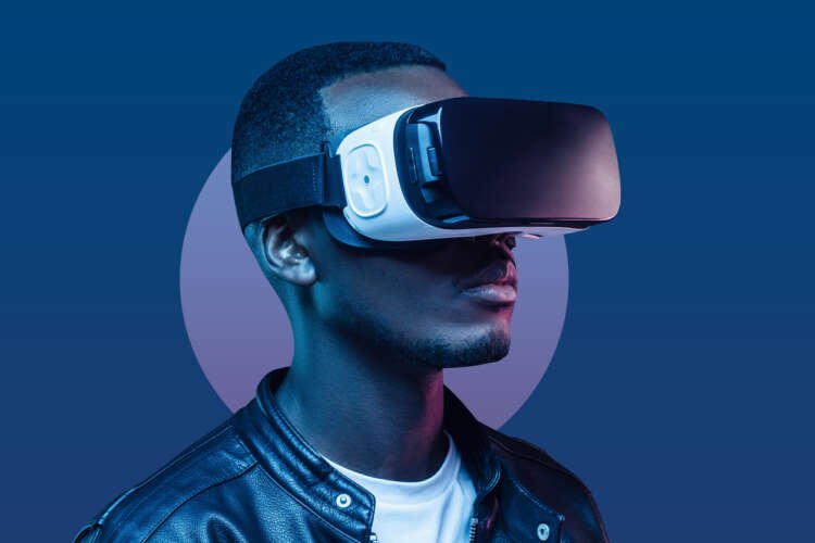 African American man wearing VR headset exploring virtual reality technology - Global Banking & Finance Review