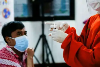 Image for Chickens, cows, apartments offered up in Asia’s vaccination lucky draws