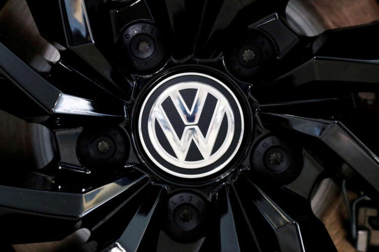 Volkswagen logo on a rim cap, highlighting wage deal amid inflation - Global Banking & Finance Review