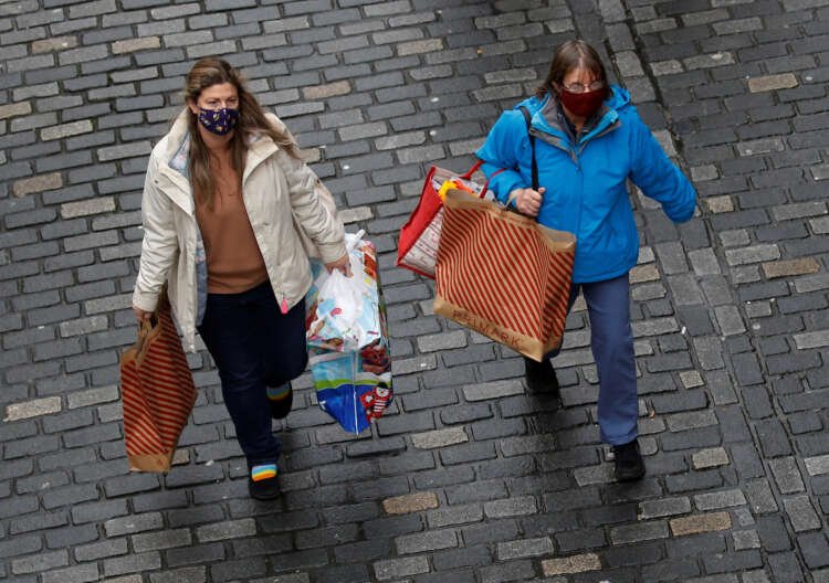 Shoppers enjoying a bustling city centre in Chester, Britain, reflecting rising consumer sentiment - Global Banking & Finance Review