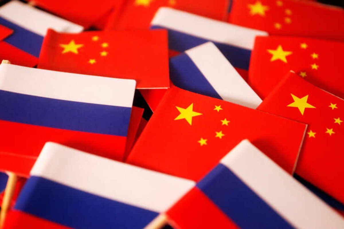 Flags of China and Russia symbolizing cooperation in finance and trade - Global Banking & Finance Review