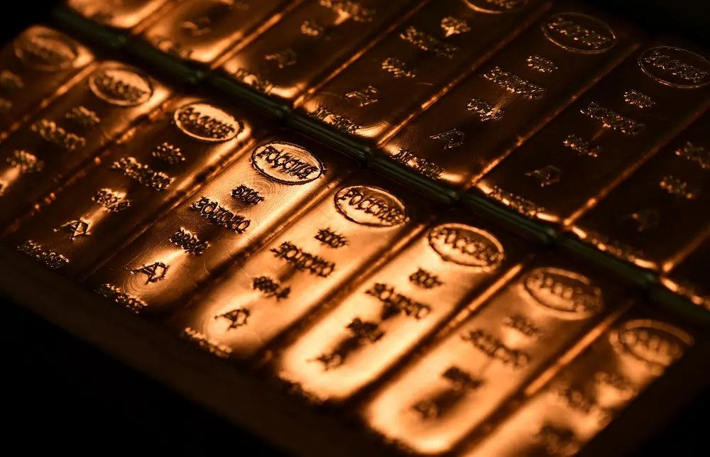 Gold bars stacked symbolizing the surging gold prices toward $3,000/oz - Global Banking & Finance Review