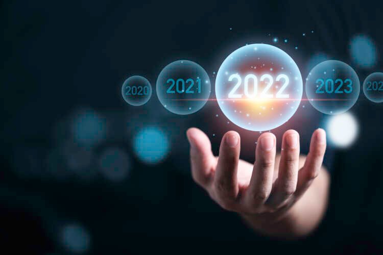 A hand holding a virtual representation of the year 2022, symbolizing finance trends - Global Banking & Finance Review