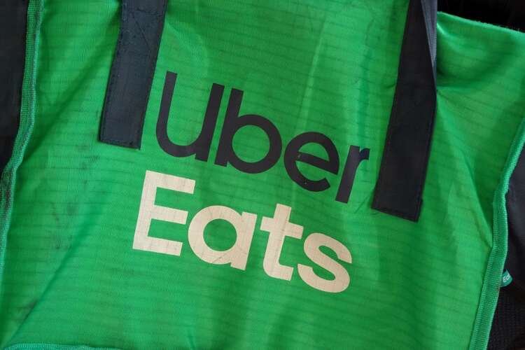 Uber Eats delivery bag on bicycle highlighting food delivery amid inflation concerns - Global Banking & Finance Review
