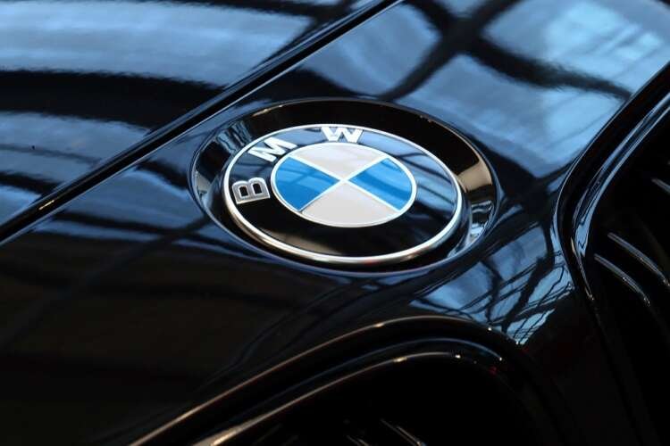 A logo of German luxury carmaker BMW, is seen ahead of the company’s annual news conference in Munich