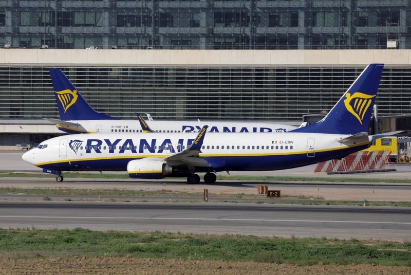 Ryanair aircraft in flight representing profit forecast and fare improvements - Global Banking & Finance Review