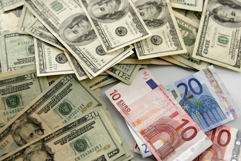 Currency exchange process with banknotes and coins - Global Banking & Finance Review