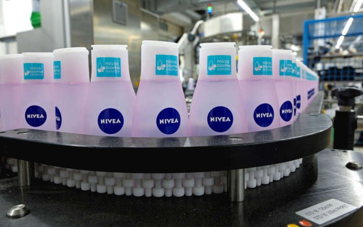 Nivea products on a production line showcasing Beiersdorf's sales growth - Global Banking & Finance Review