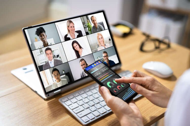Business professionals engage in a virtual meeting, highlighting hybrid working in financial services - Global Banking & Finance Review
