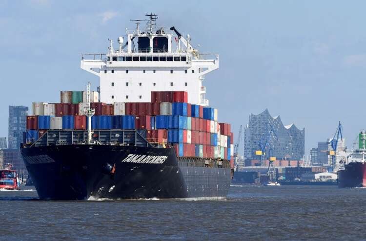 Container ship departing Hamburg port, symbolizing Euro zone trade recovery - Global Banking & Finance Review