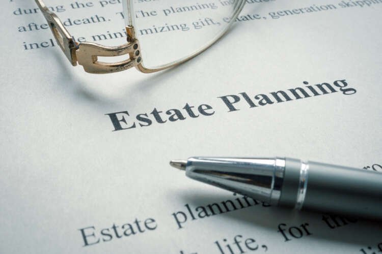 Estate planning tools and documents on a desk - Global Banking & Finance Review