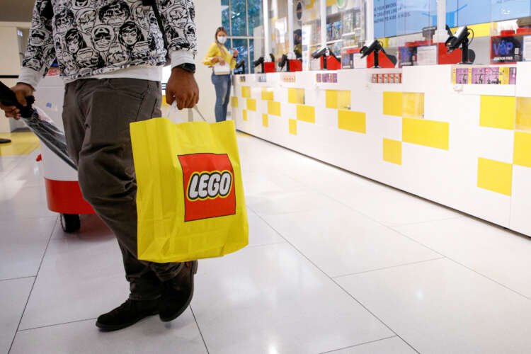 Customer shopping in the 5th Avenue Lego store, reflecting robust demand - Global Banking & Finance Review