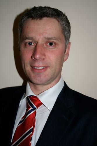 Professional discussing BYOD implementation strategies in the workplace - Global Banking & Finance Review