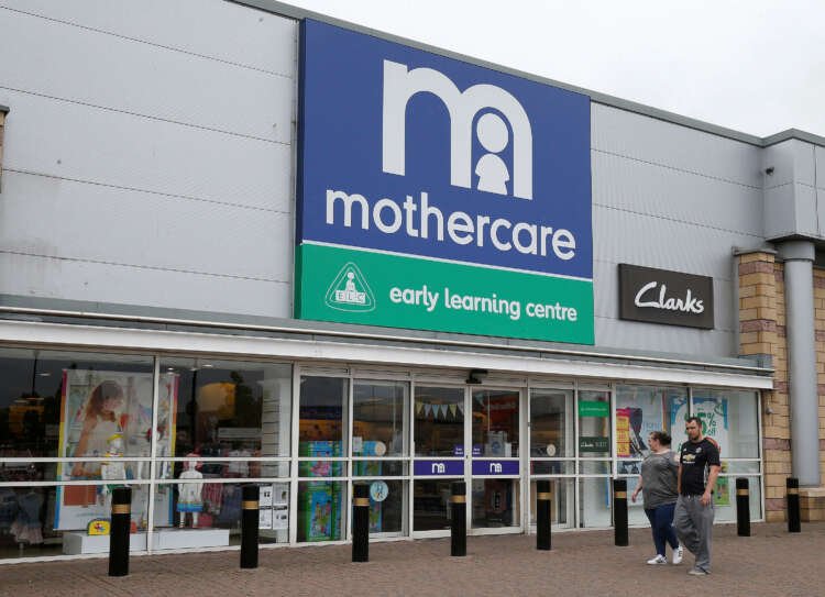 People walking past a Mothercare store, highlighting retail challenges in UK finance - Global Banking & Finance Review